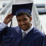 man holding his graduation cap