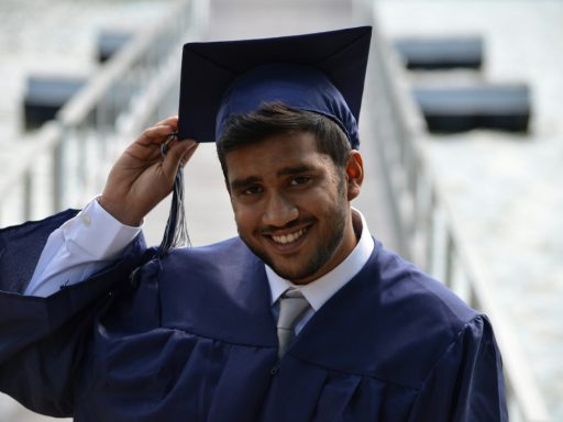 man holding his graduation cap