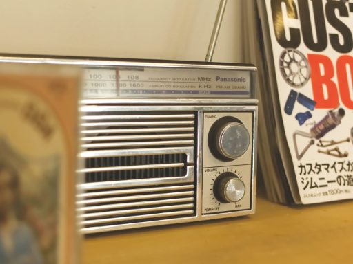 A radio sitting on top of a wooden table