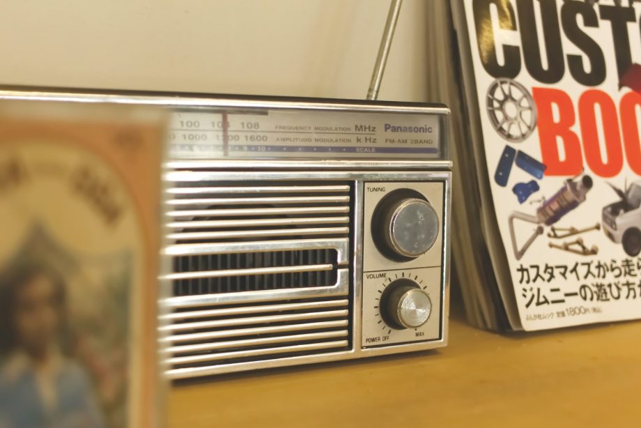 A radio sitting on top of a wooden table