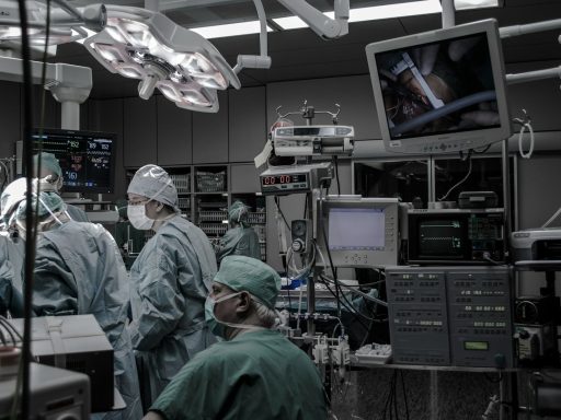 people wearing surgical clothes inside operating room