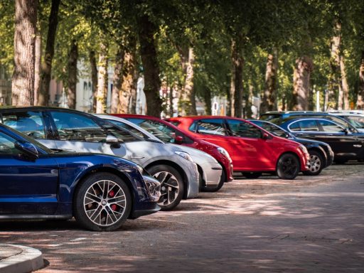 blue and red sports car on road during daytime
