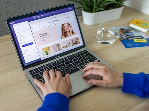 a person typing on a laptop on a table