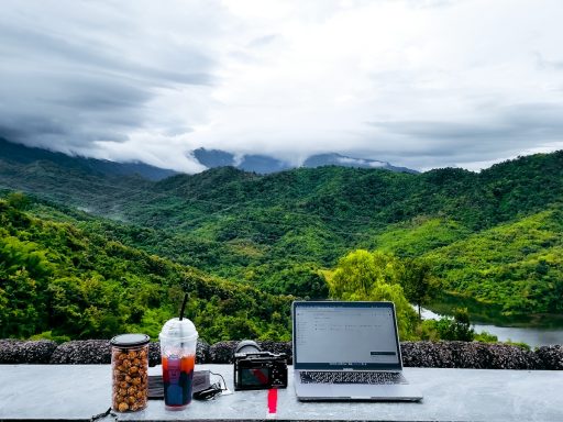 a laptop computer sitting on top of a table