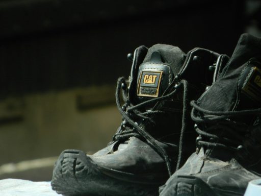 A pair of black shoes sitting on top of a table
