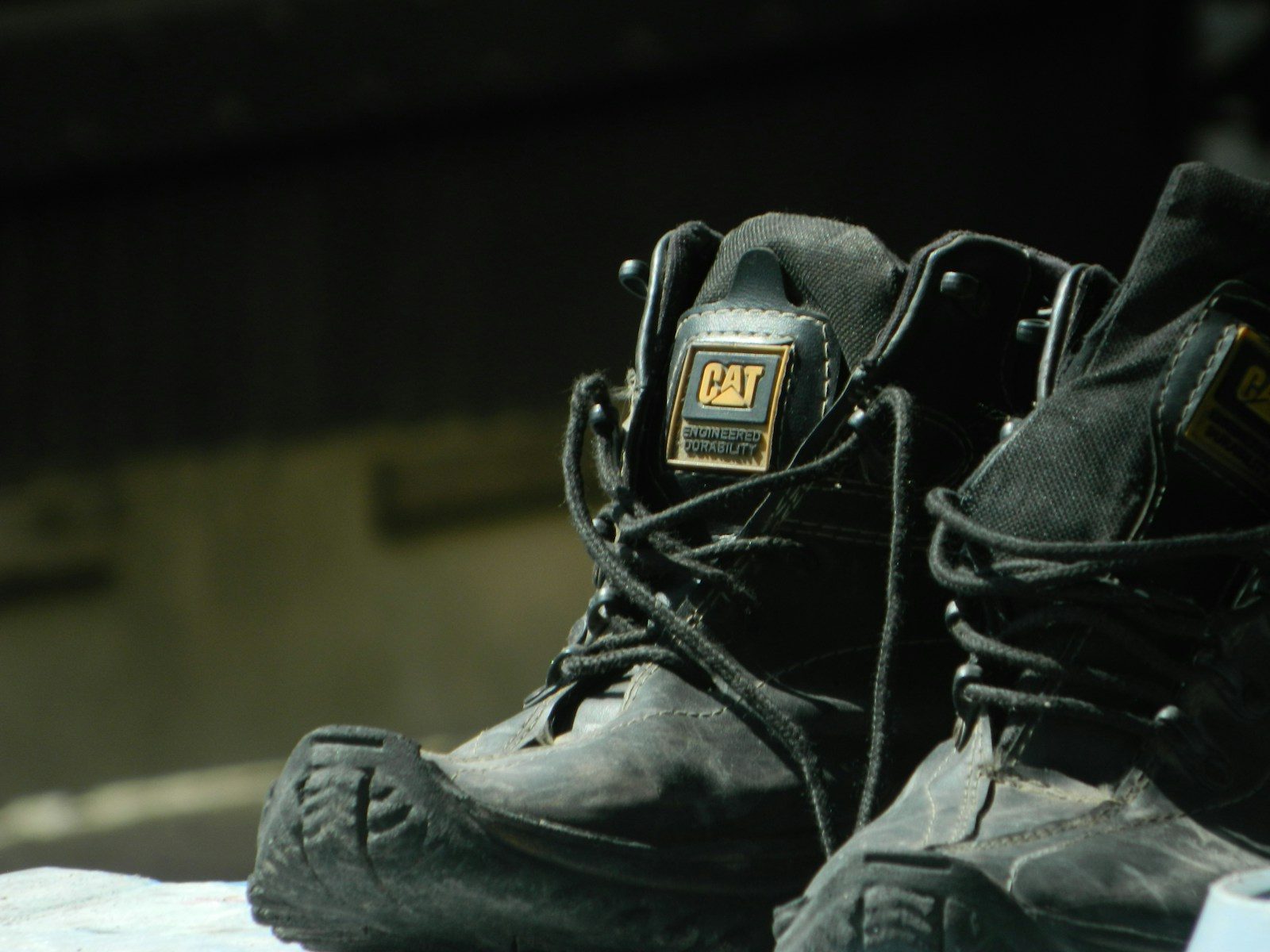 A pair of black shoes sitting on top of a table