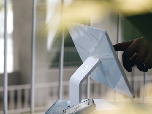 A person using a laptop computer on a table