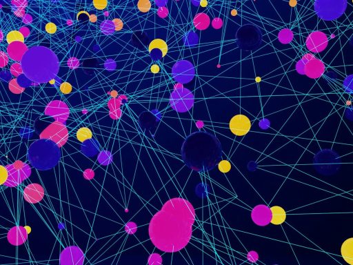 a large group of colorful balls floating in the air