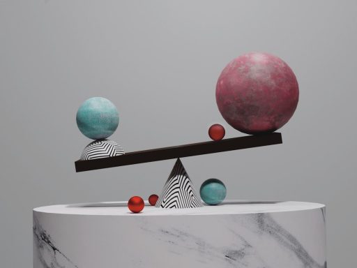 a sculpture with balls on top of it