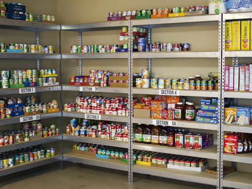 A large metal shelf filled with lots of food
