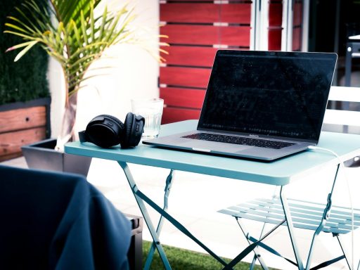 black laptop computer on white table